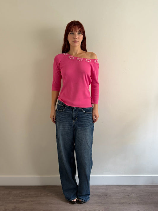pink top with denim jeans