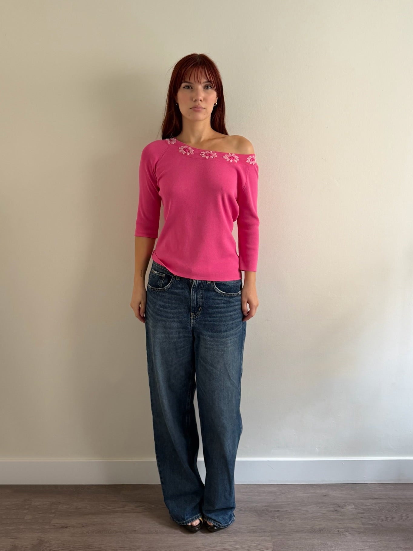 pink top with denim jeans