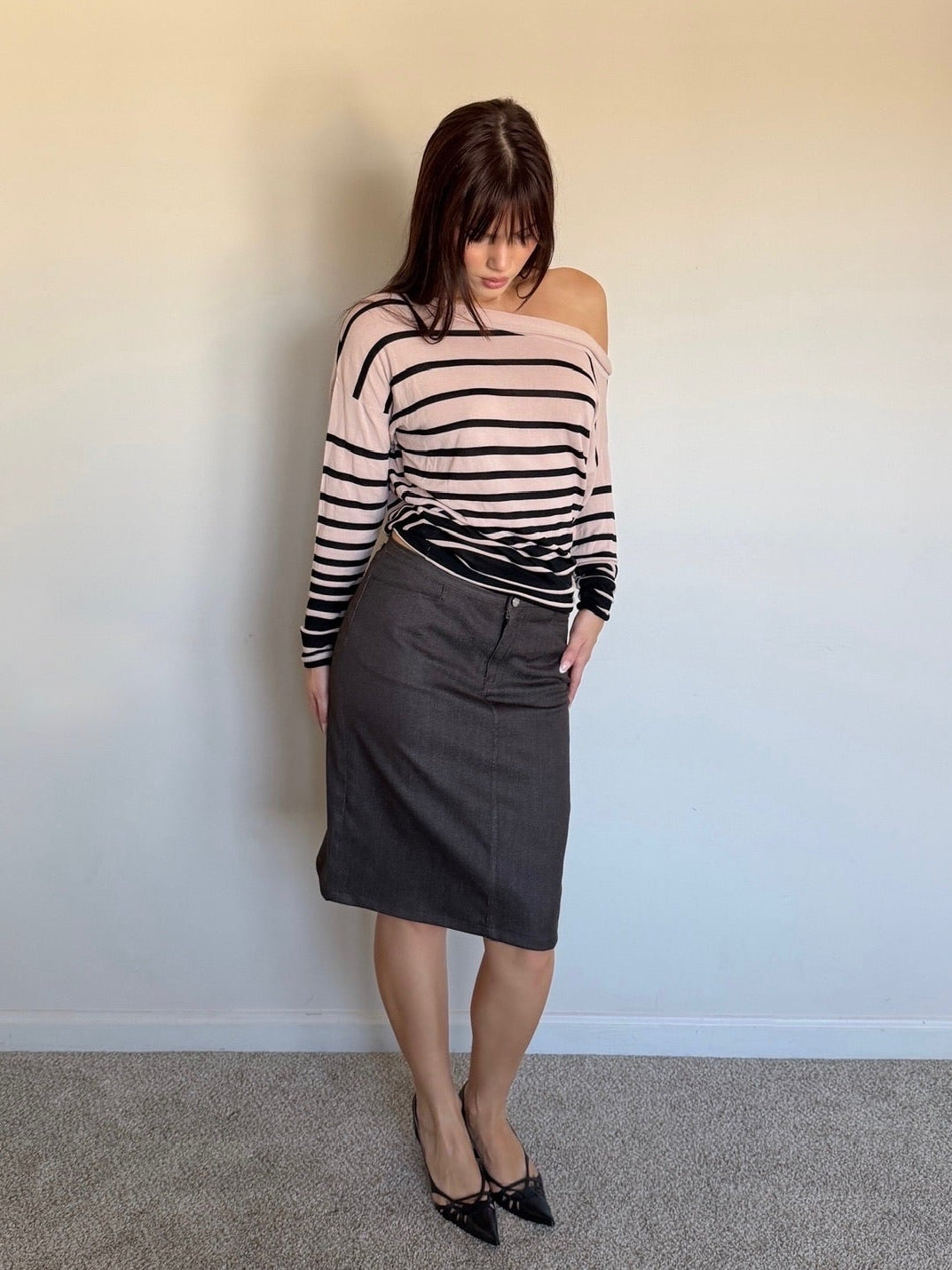 cream and black longsleeve that is off the shoulder with brown skirt and black heels