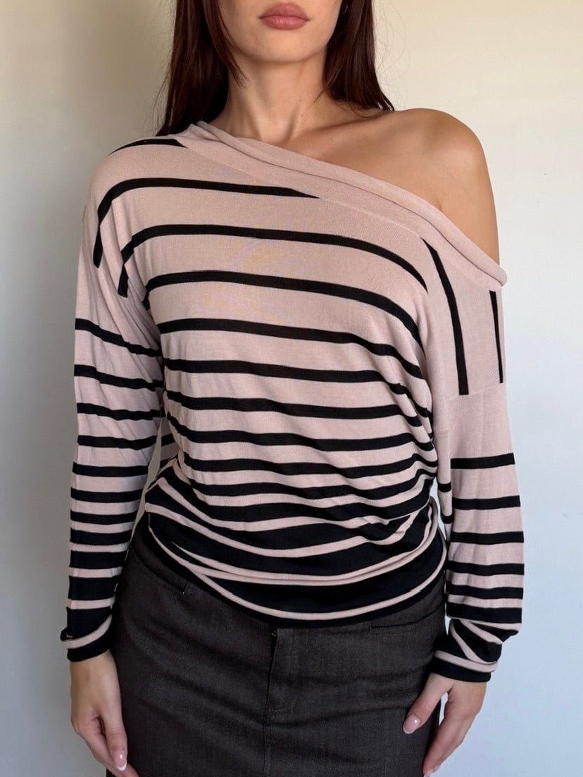cream and black longsleeve that is off the shoulder