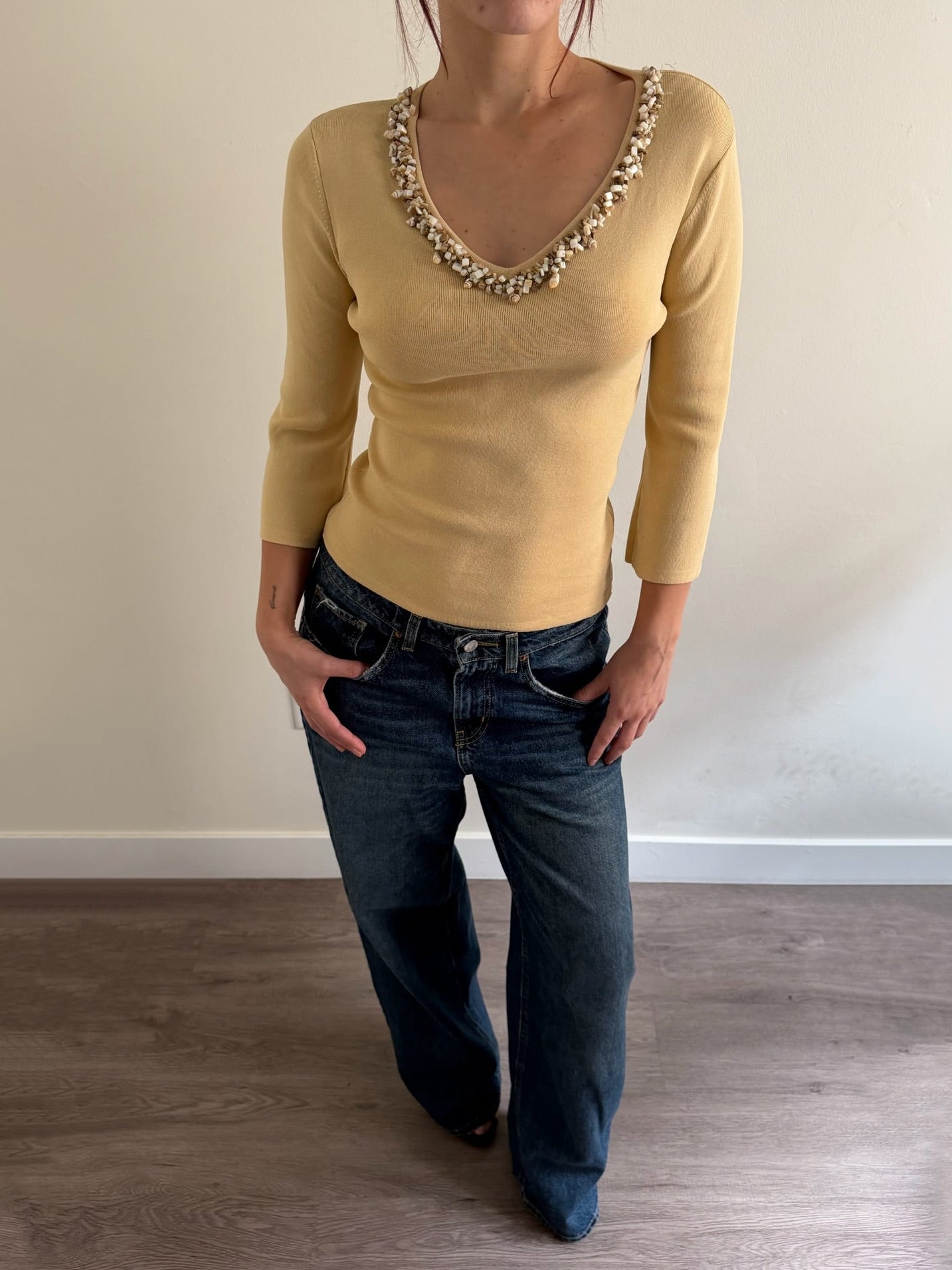 cream top with shell details