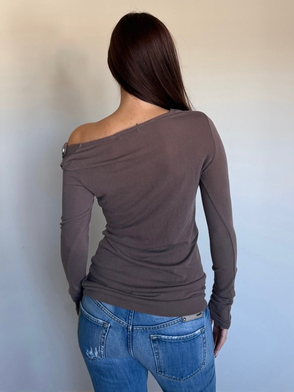 backside of asymmetrical top with buttons 
