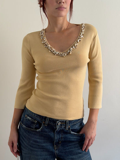 cream top with shell detail on the collar