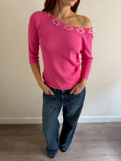pink top and denim jeans