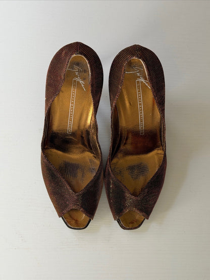 Pair of brown open-toe shoes on a white background