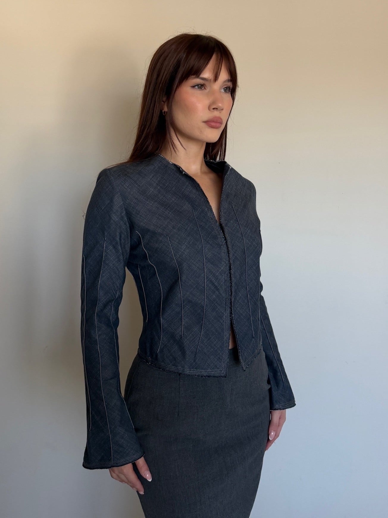 side angle of a cropped denim jacket