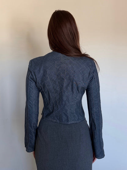 backside of a cropped denim jacket