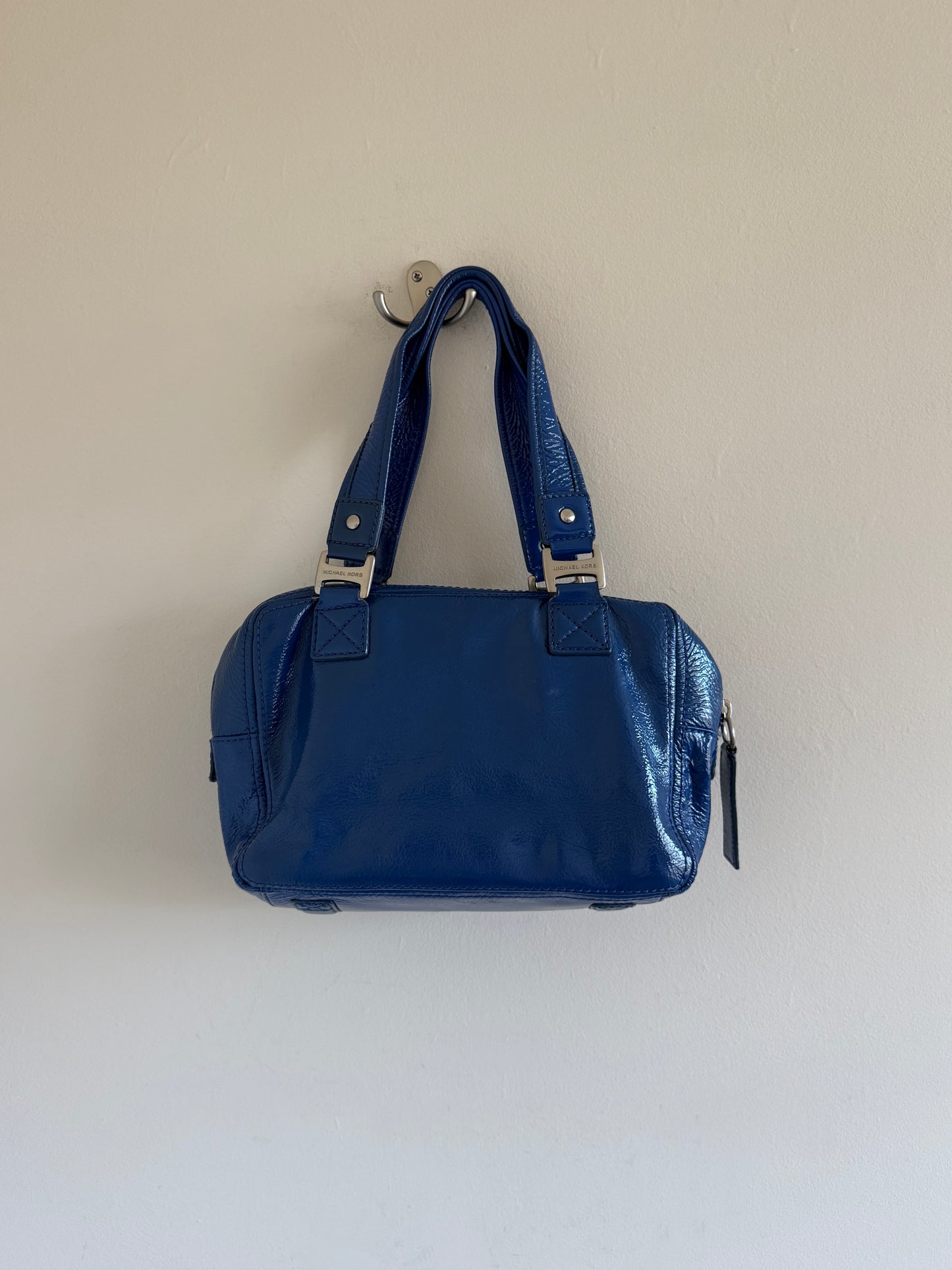 Blue handbag on a light beige background