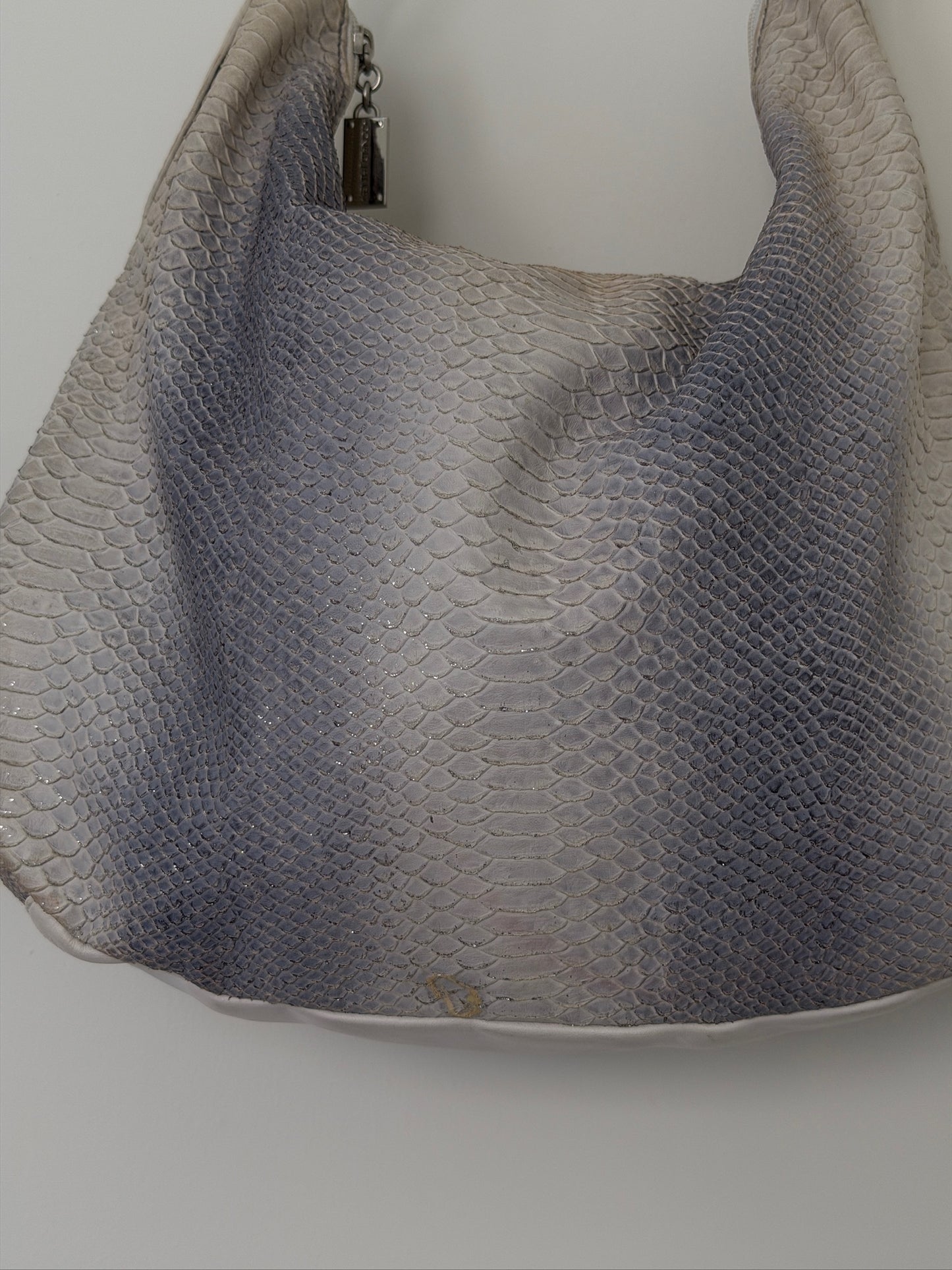 Textured handbag on a plain background