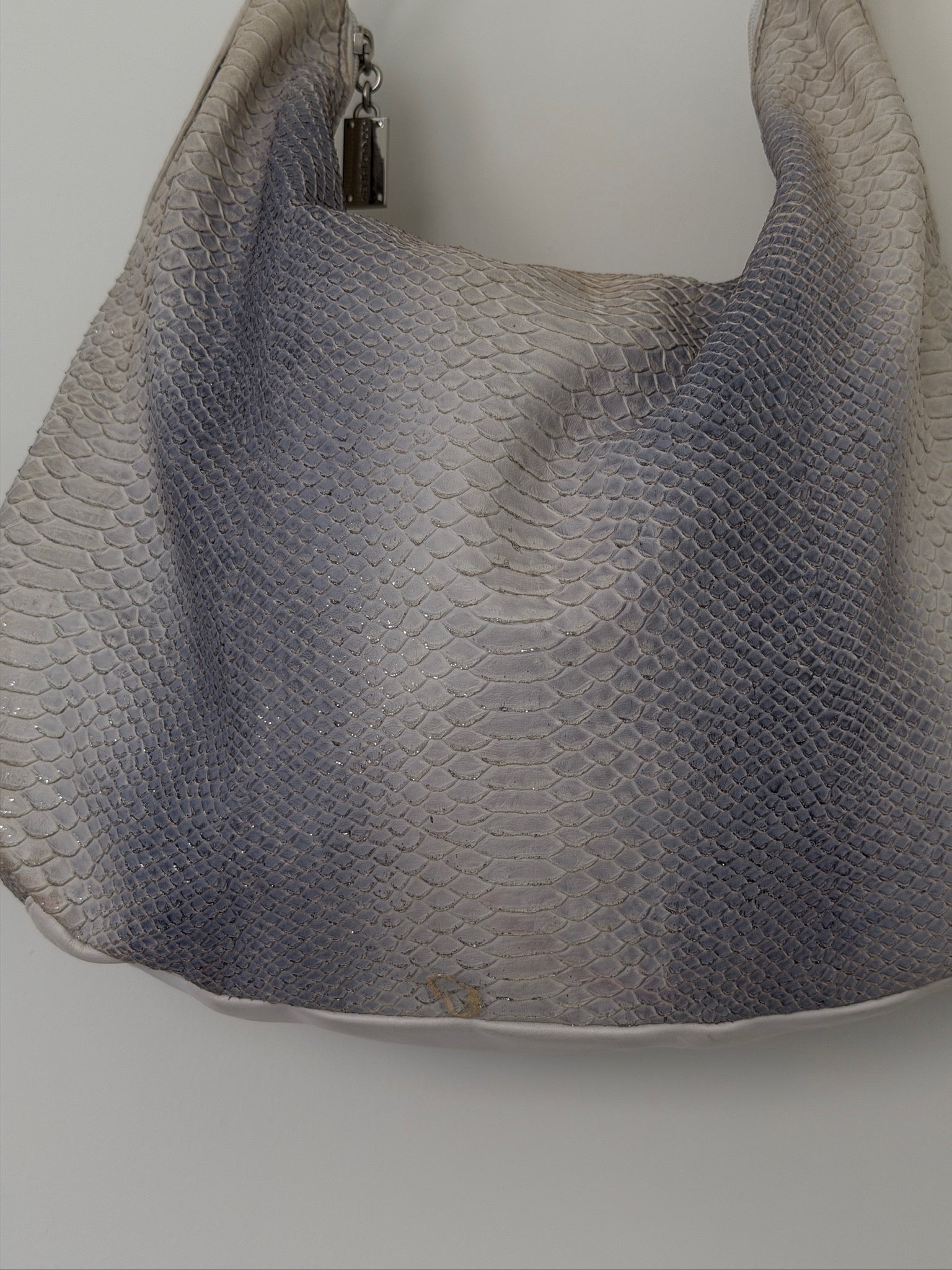 Textured handbag on a plain background
