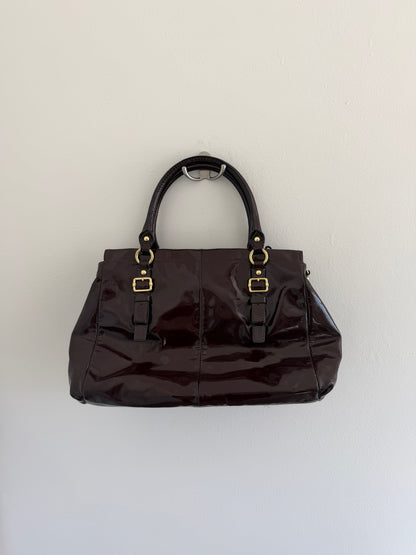 deep plum with gold hardware on a white background