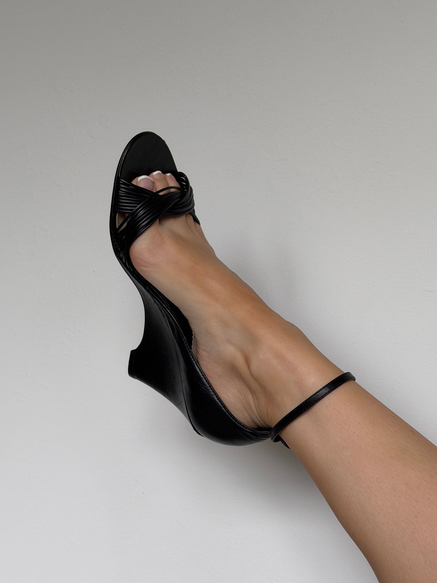 Black sandal on a neutral background