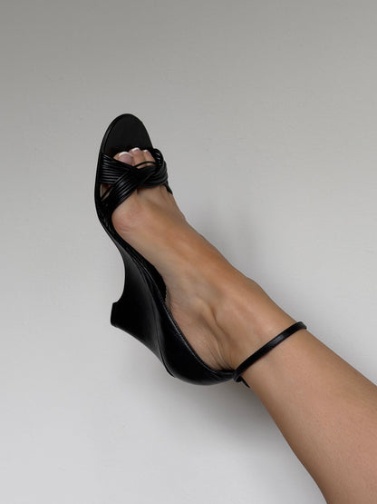Black sandal on a neutral background