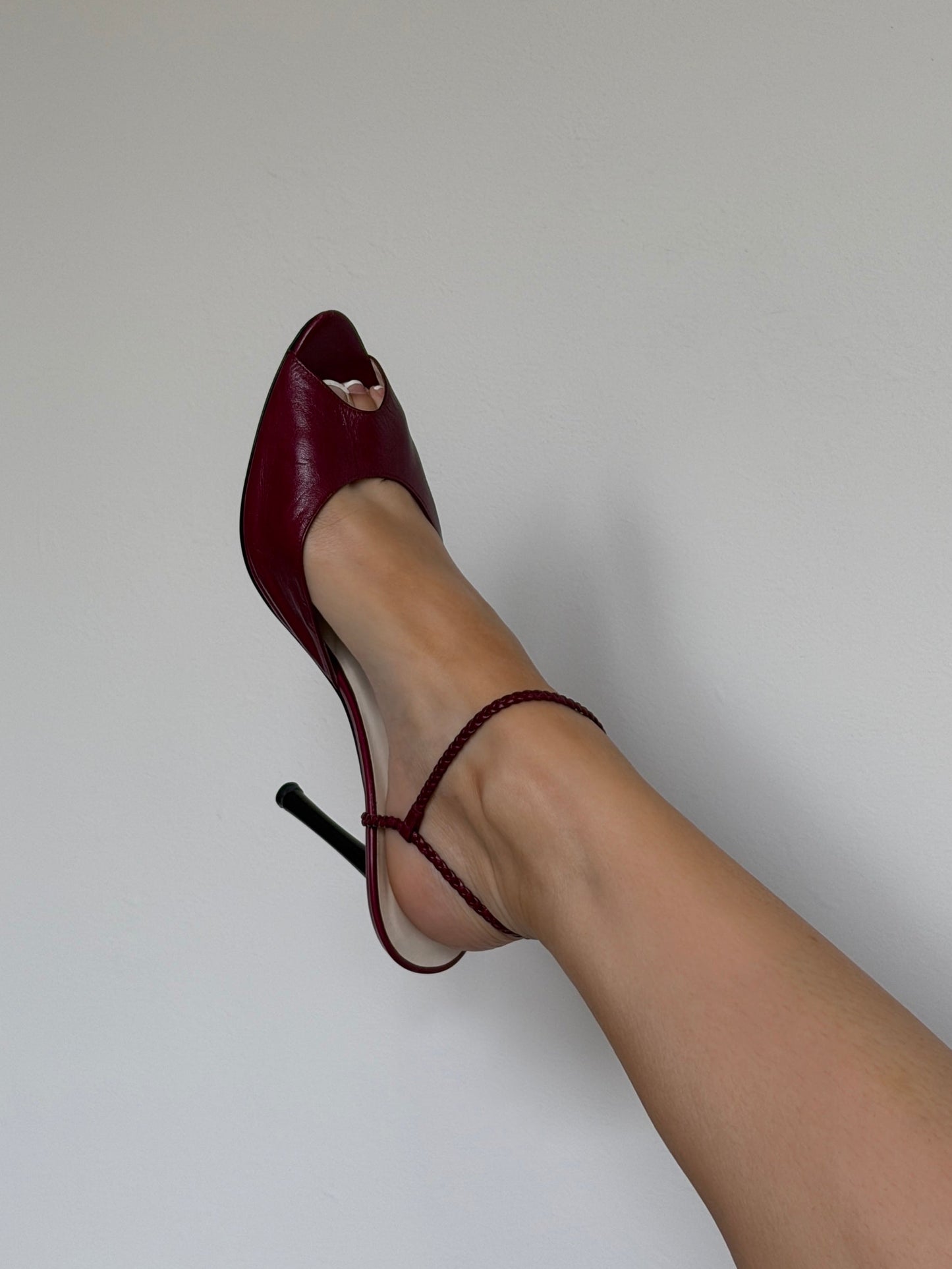 Red high-heeled shoe on a white background