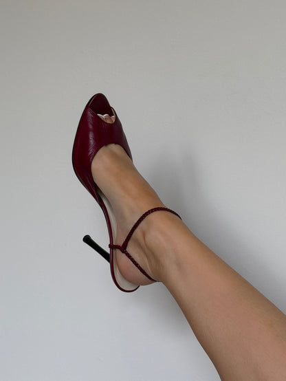 Red high-heeled shoe on a white background