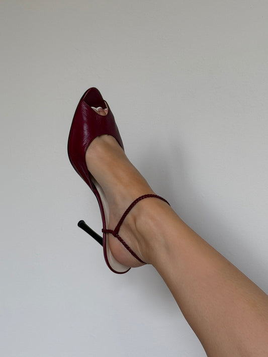 Red high-heeled shoe on a white background