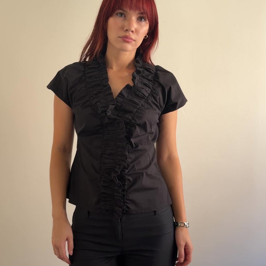 video of black ruffle blouse
