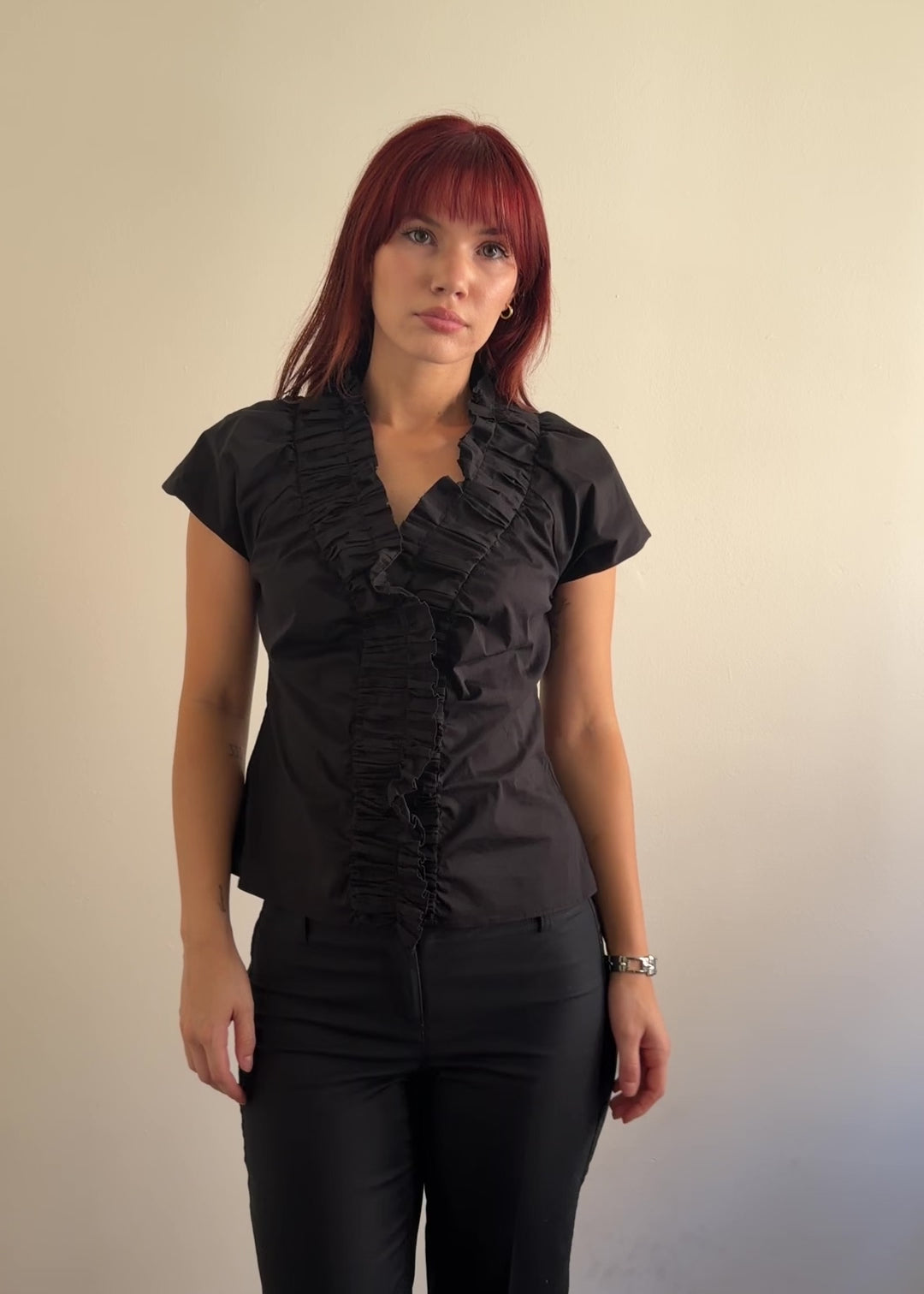video of black ruffle blouse