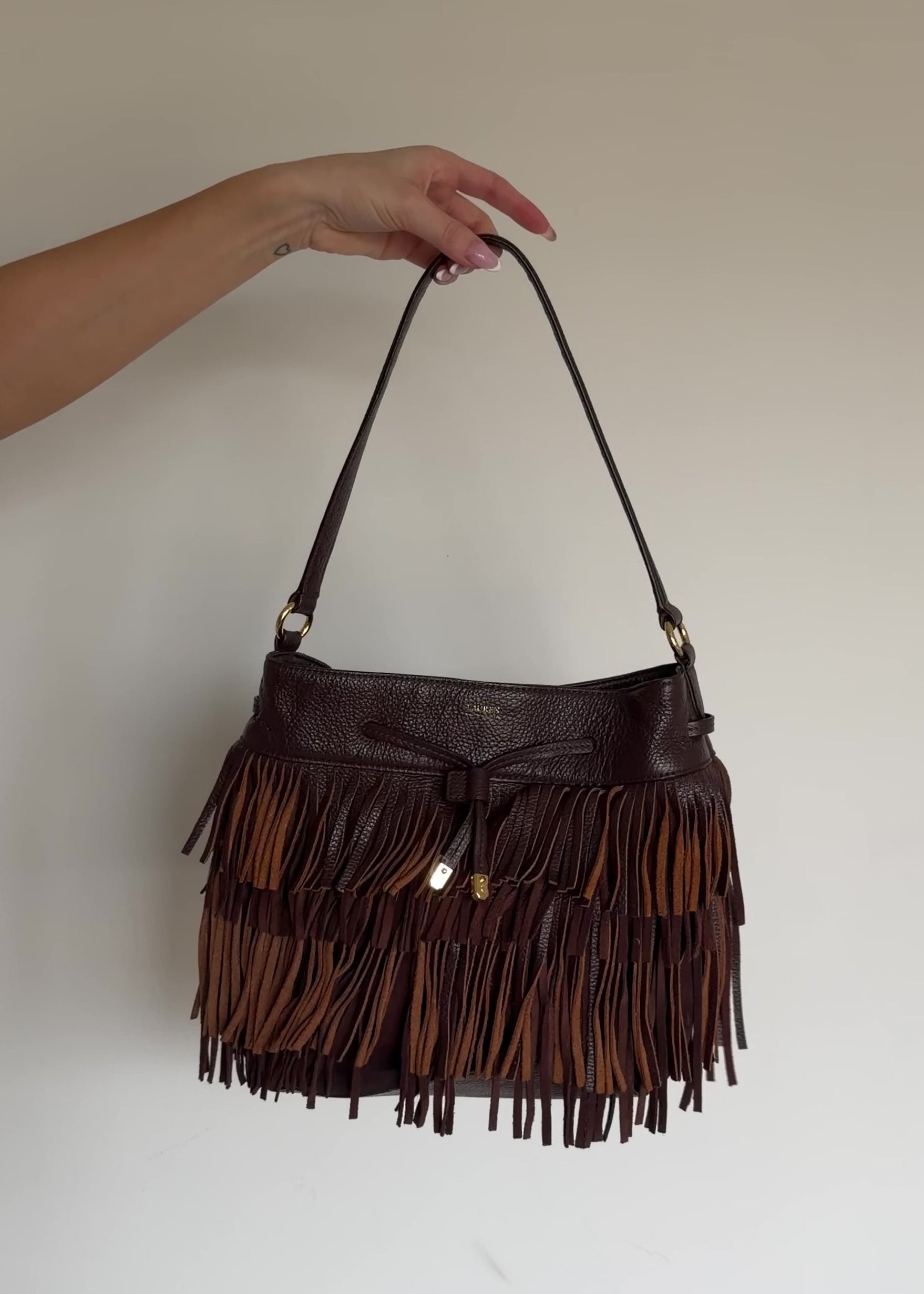 video of fringe leather bag