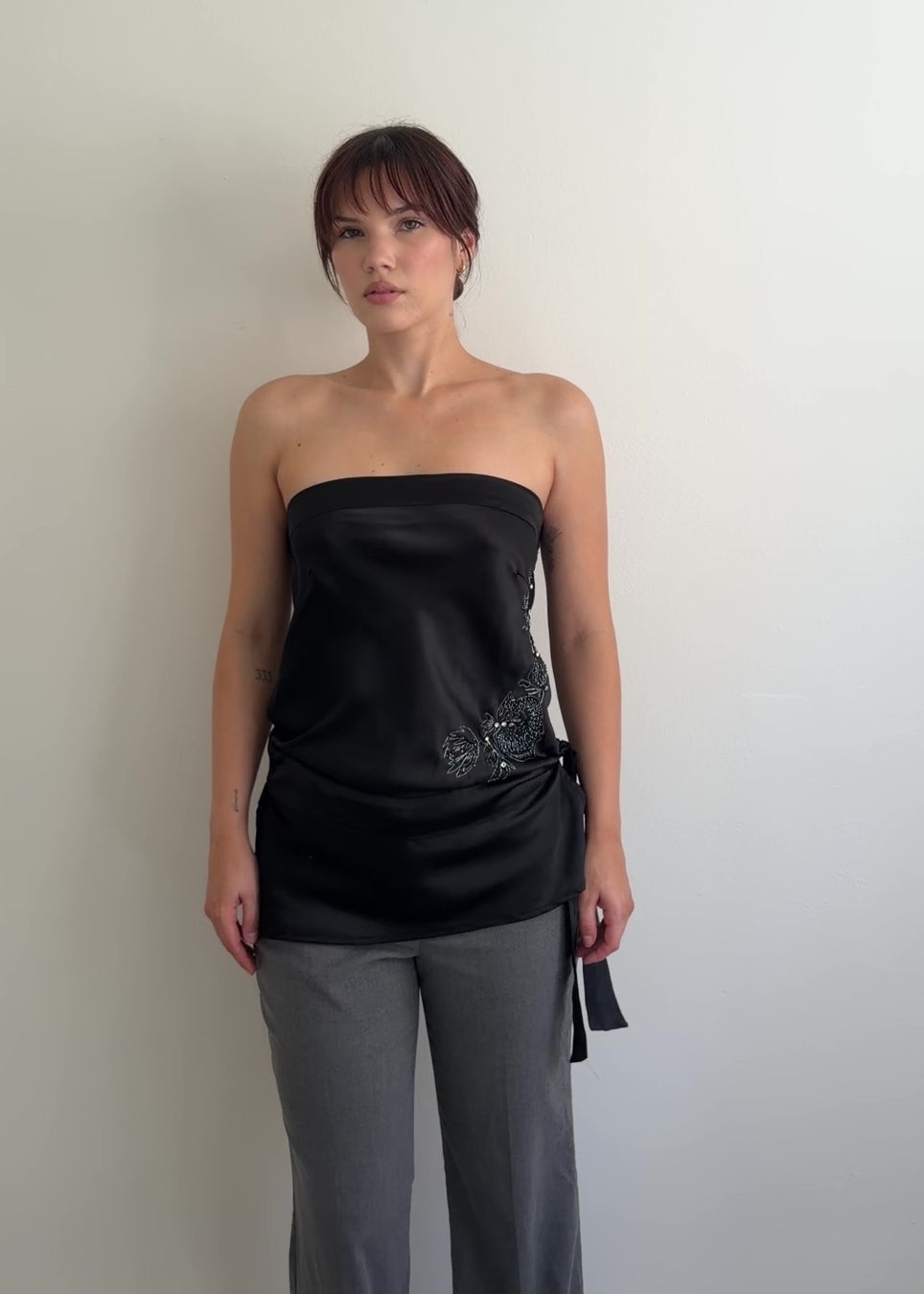  video of black strapless top shown from different angles