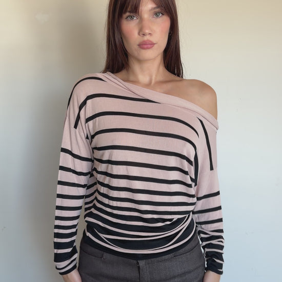 video of a cream and black longsleeve that is off the shoulder