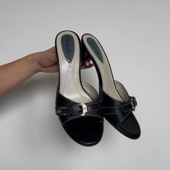 video of black buckle heels
