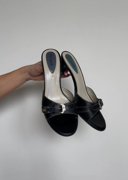 video of black buckle heels