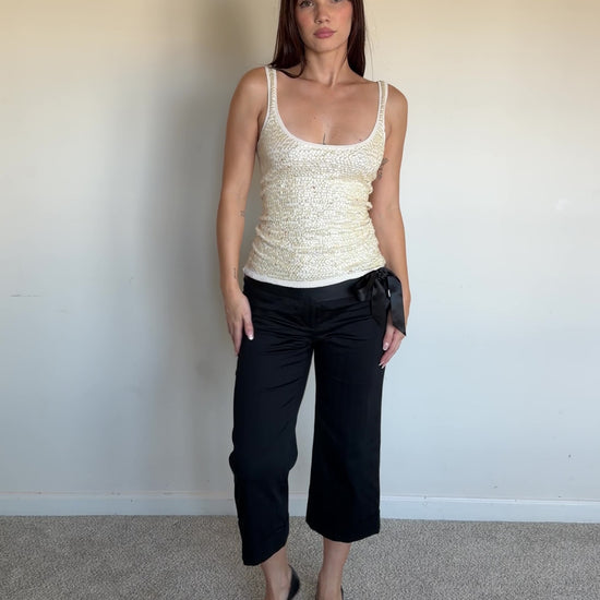 video of a cream sequin top with black capris 