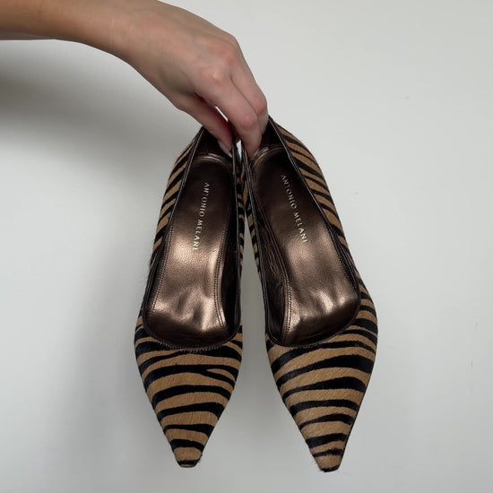 video of different angles of the brown zebra heels