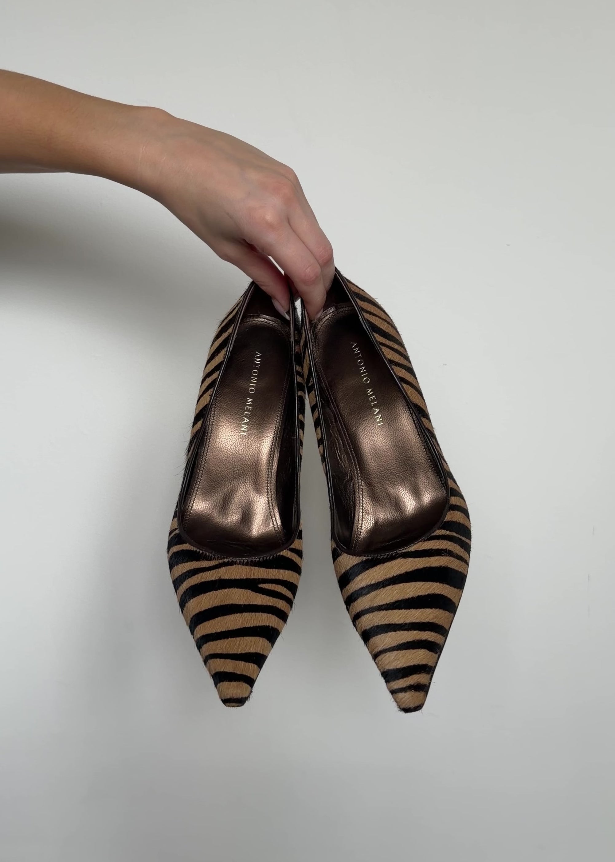 video of different angles of the brown zebra heels