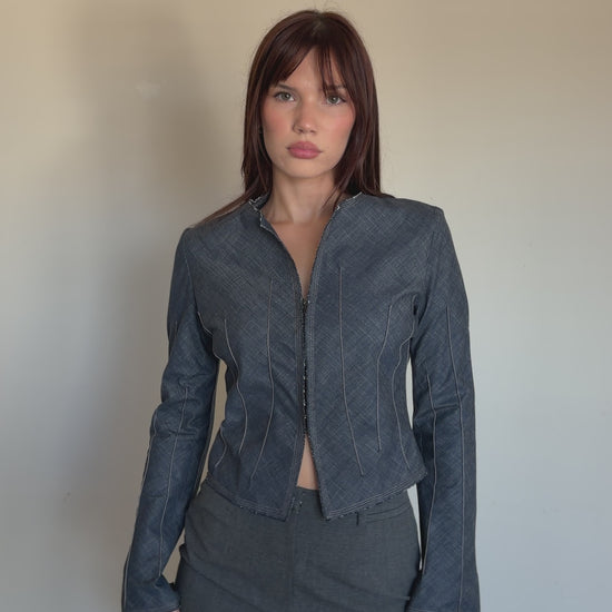 video of cropped denim jacket with grey pencil skirt 