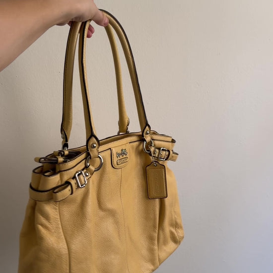 video of yellow coach bag